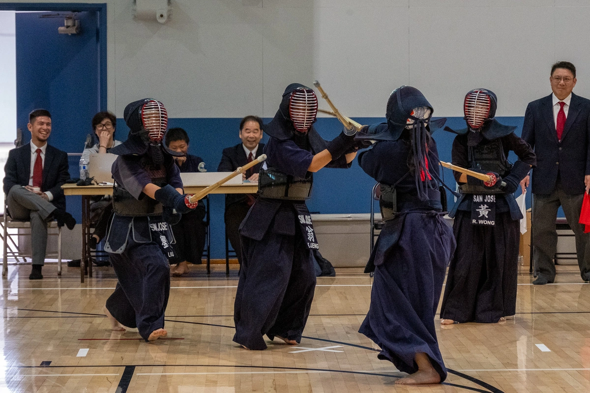 Carolyne Ikeda fighting against three younger girls