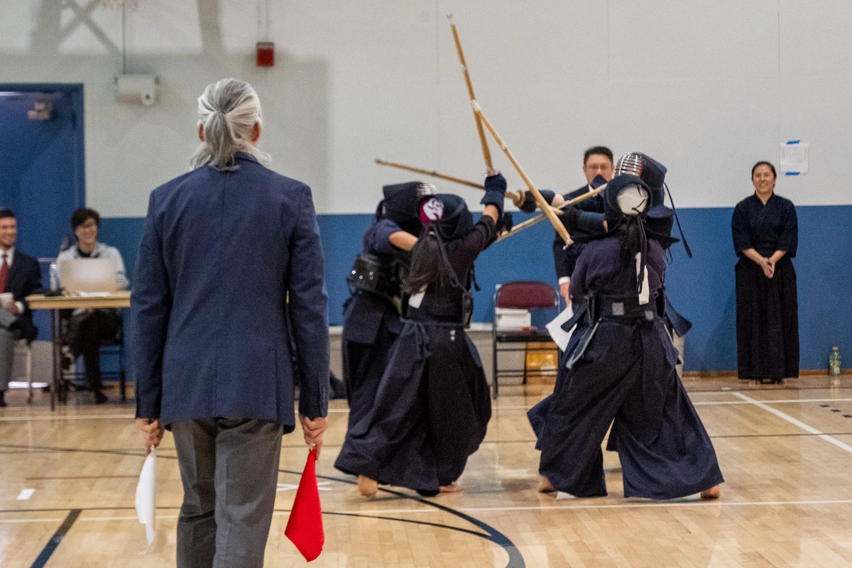 Carolyne Ikeda fighting against three younger girls