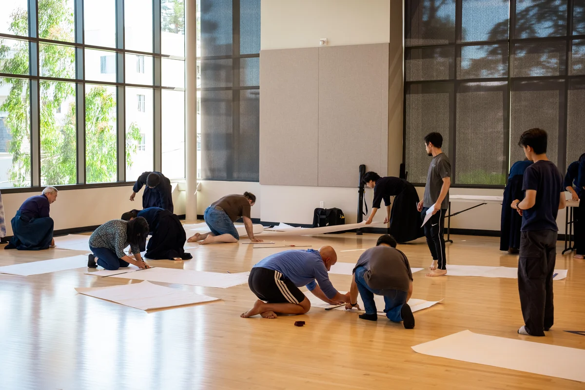 Volunteers preparing tournament brackets before the taikai