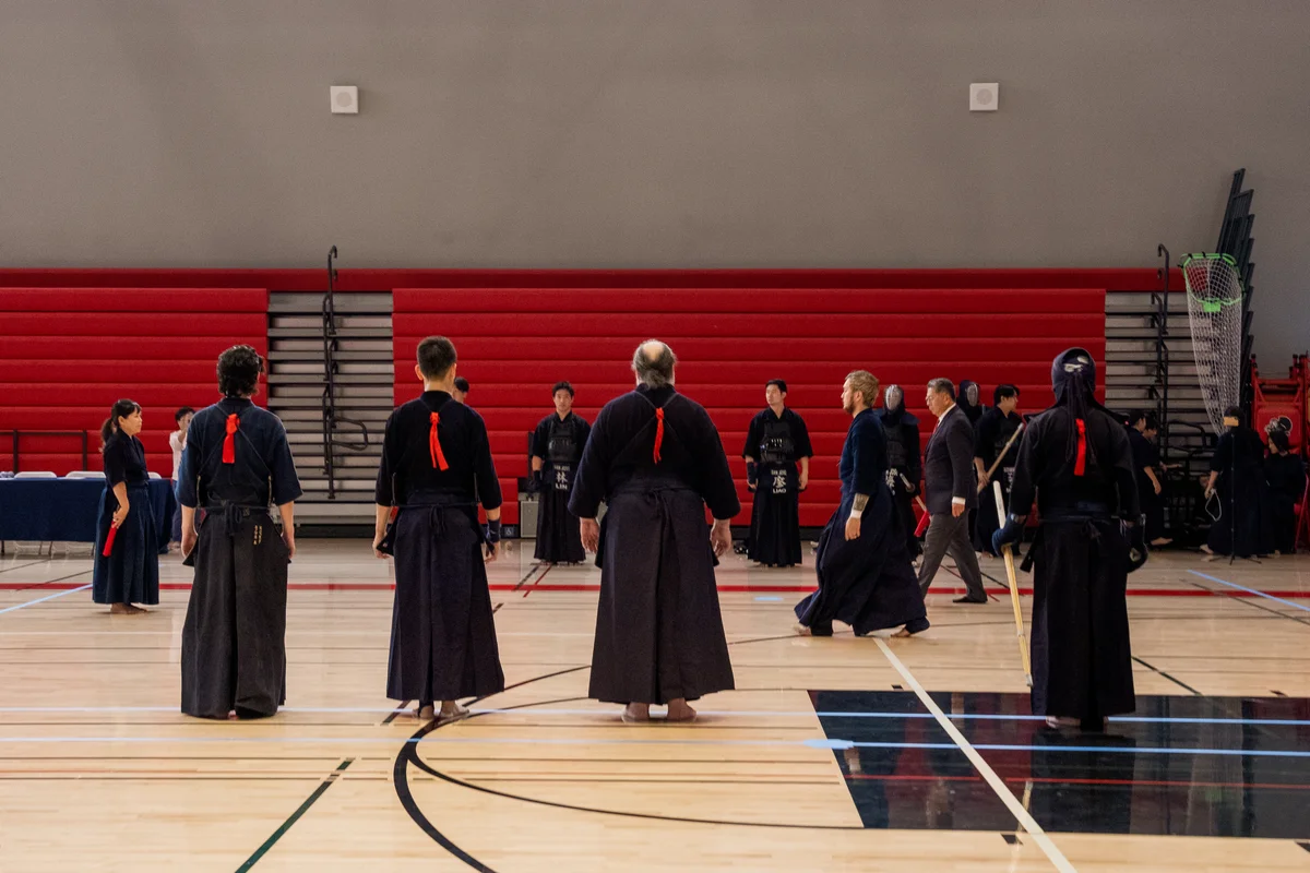 Kenshi standing together on the gym floor