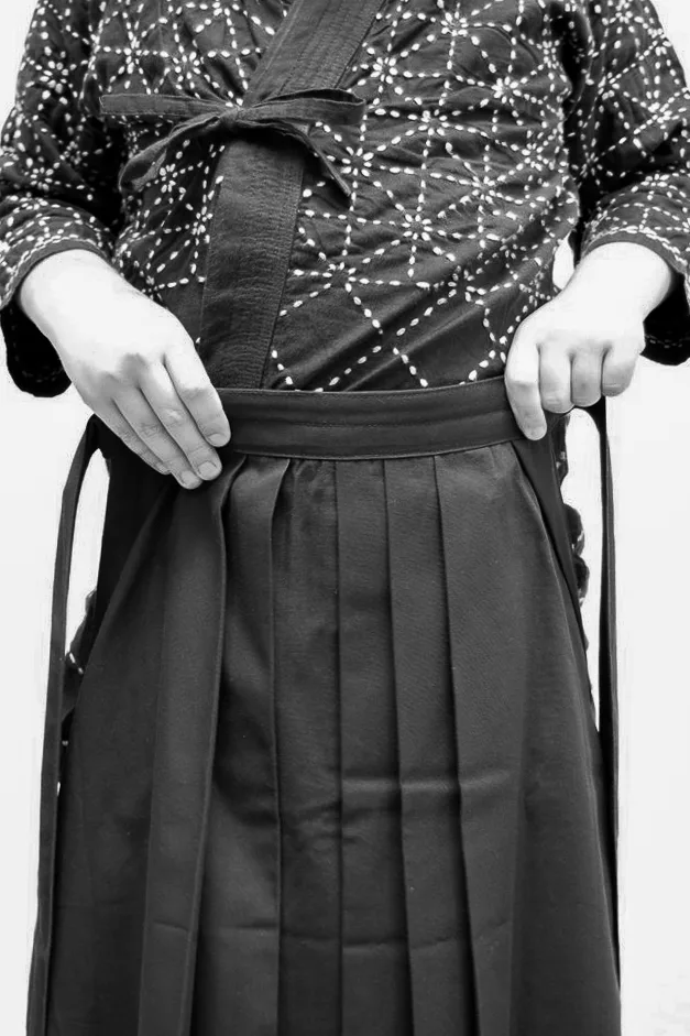 Step 1 of tying the hakama