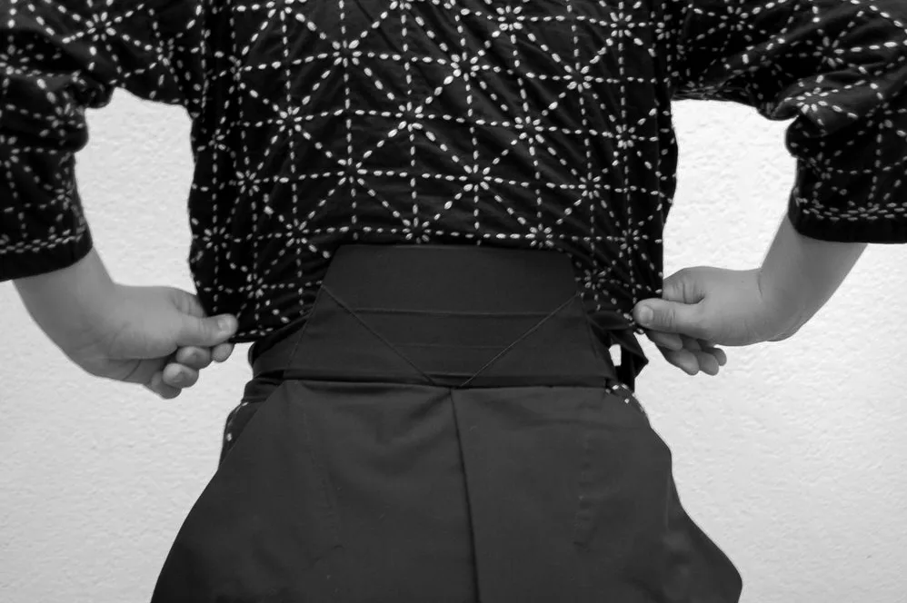 Step 22 of tying the hakama